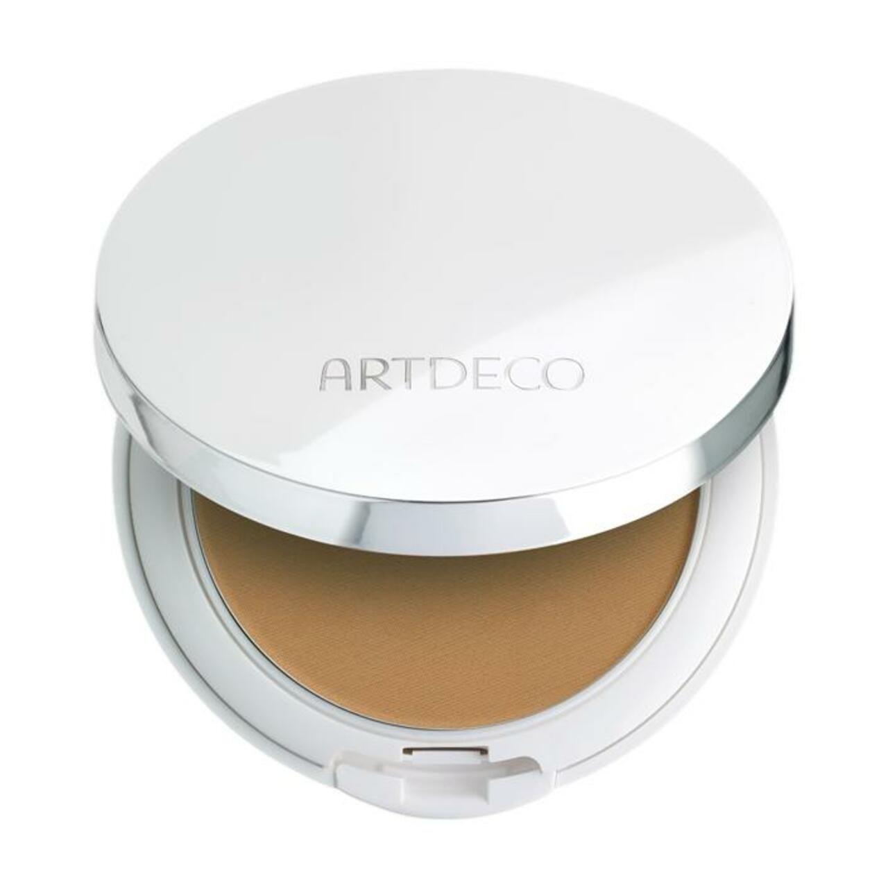 Compacte foundation met deksel. Witte behuizing, zilveren rand. Opschrift ARTDECO. Crèmefoundation in lichte tint.