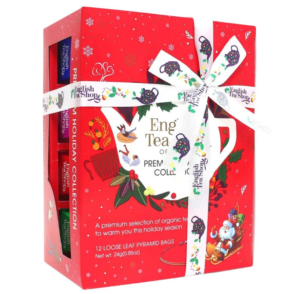 Rode geschenkdoos met lint. Opschrift: English Tea Shop, Winter Collection. Bevat theezakjes. Sneeuwvlokken decoratie.
