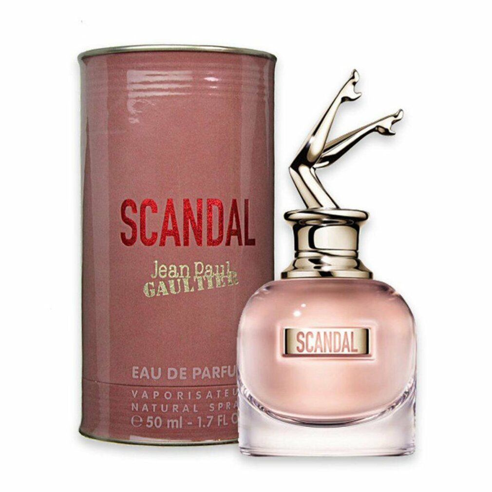 Flacon et emballage de parfum. Flacon avec jambes dorées. Inscription: SCANDAL, Jean Paul Gaultier.