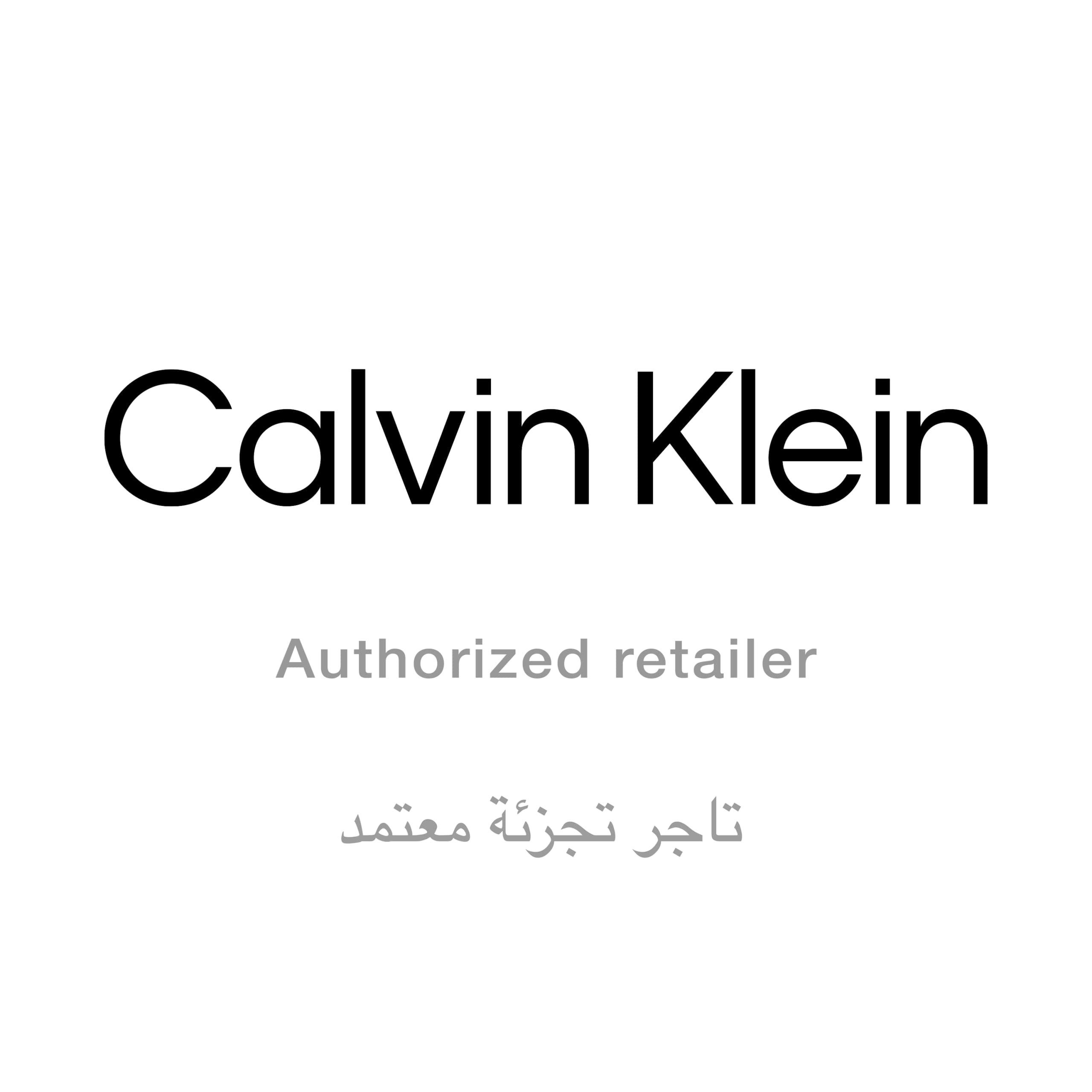 Logo Calvin Klein. En dessous, « Authorized retailer » et du texte arabe.