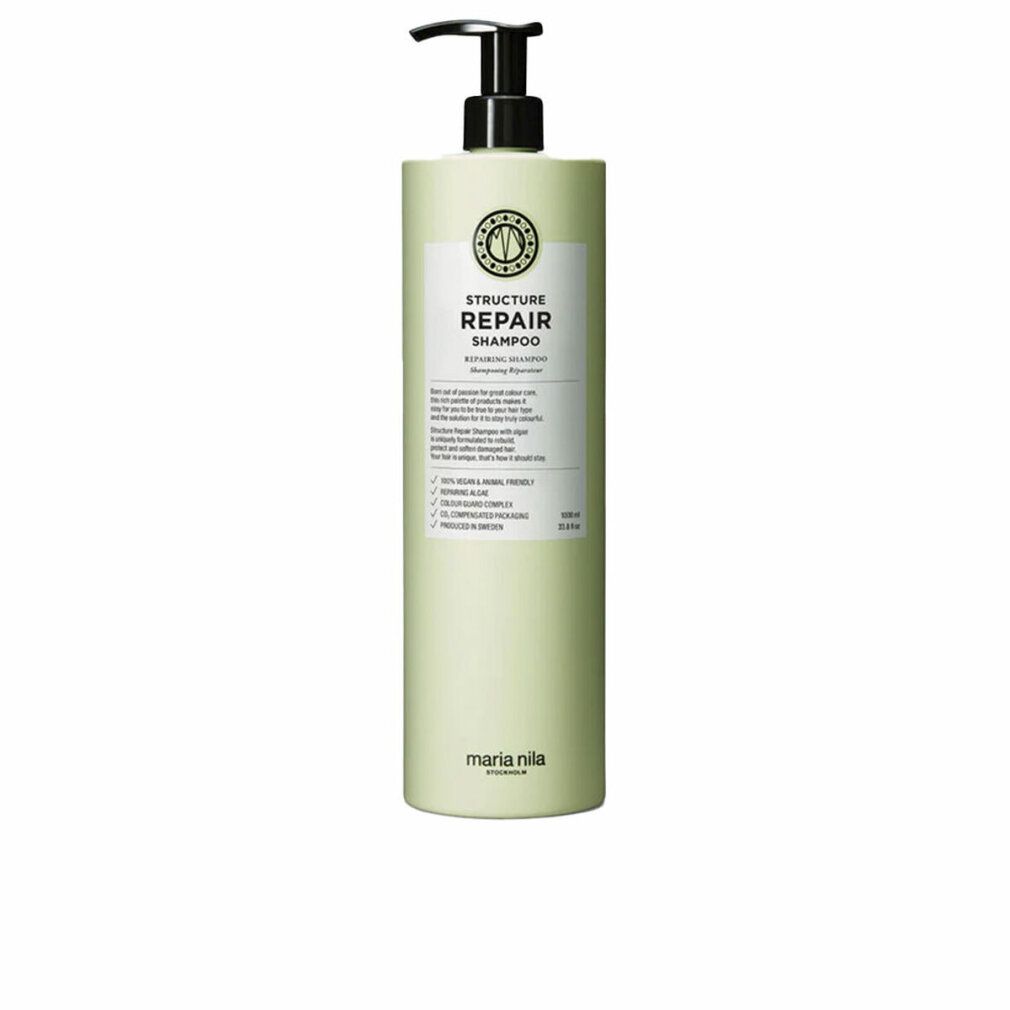 Flacon vert pâle avec pompe, étiquette indiquant "Structure Repair Shampoo" et "Maria Nila".