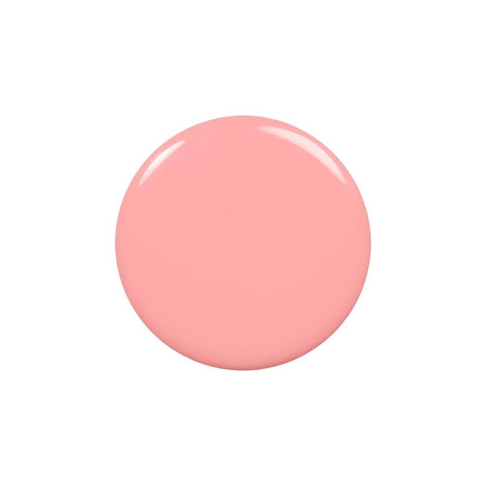 Cirkelvormige roze nagellakvlek op witte achtergrond.