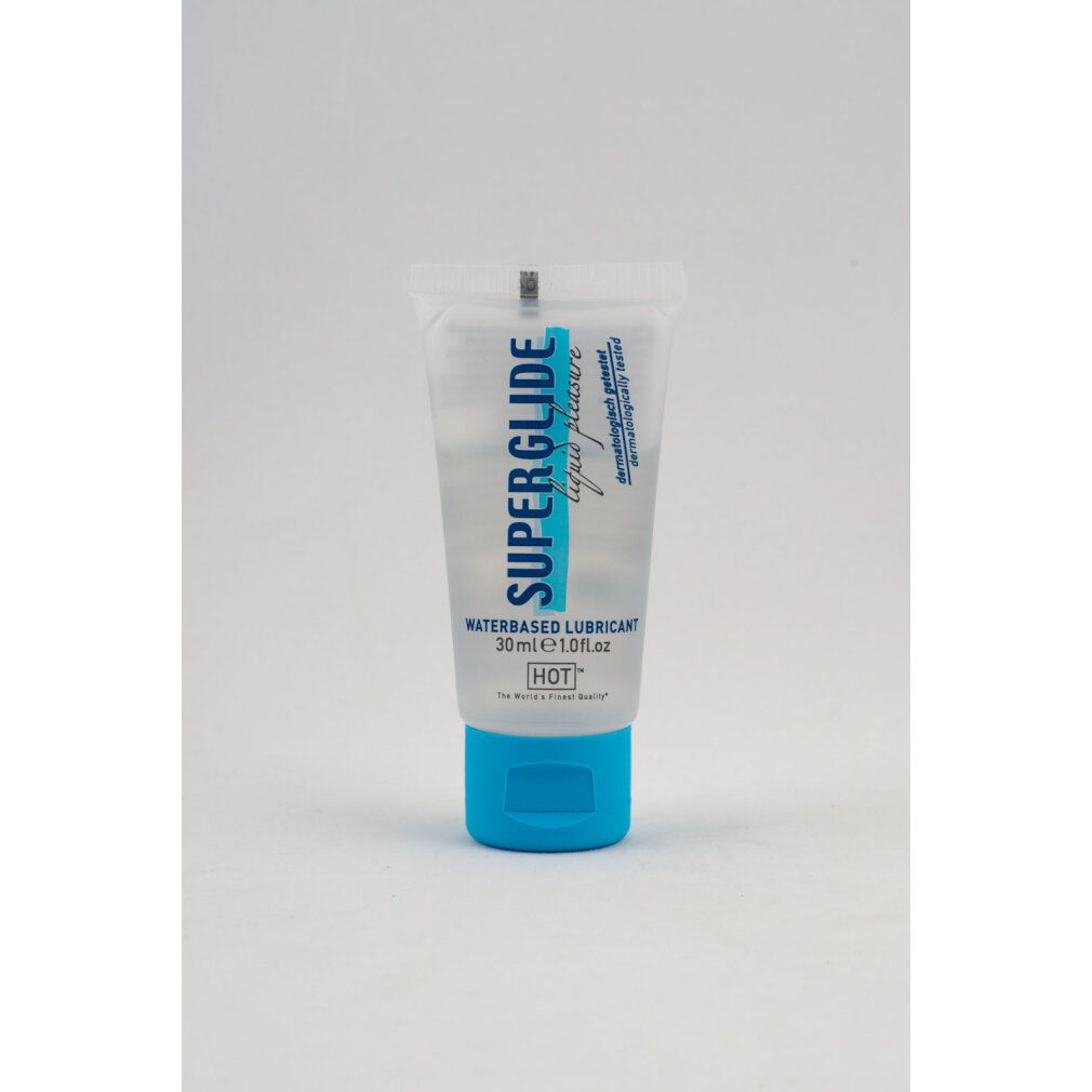 Transparante tube met blauwe dop. Opschrift: SUPERGLIDE liquid pleasure WATERBASED LUBRICANT. 30ml. Dermatologisch getest.