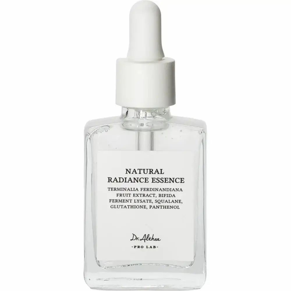 Flacon d'essence transparent avec bouchon blanc et pipette. Inscription : Natural Radiance Essence.