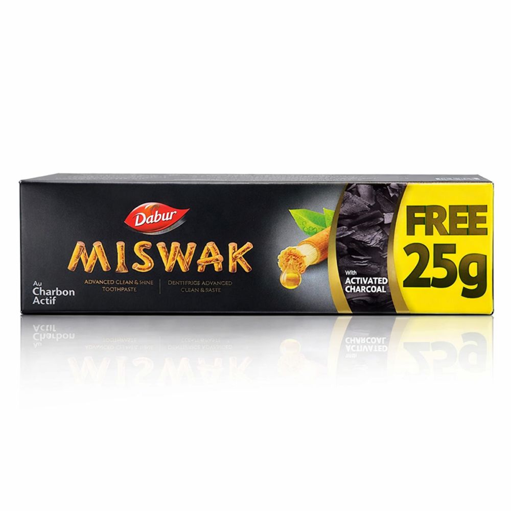 Dabur Miswak Dentifrice au Charbon Actif, 25g gratuit. Emballage noir avec accent jaune.