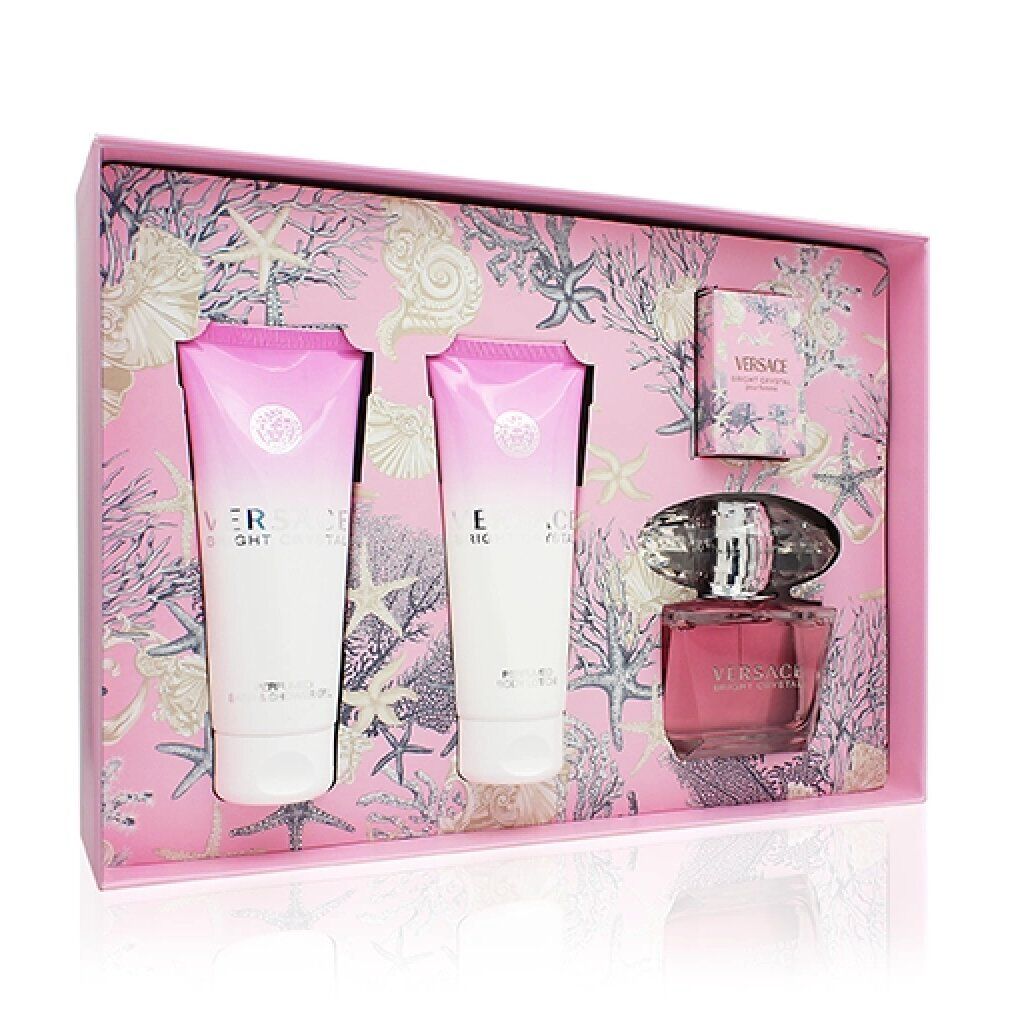 Open cadeaudoos met twee tubes, een parfumfles en een klein doosje. Roze binnenkant met zeemotieven.