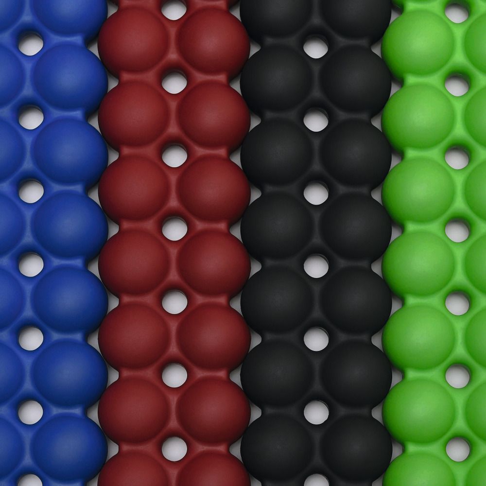 Close-up van Spinefitters in blauw, rood, zwart en groen. Het oppervlak bestaat uit ronde elementen.