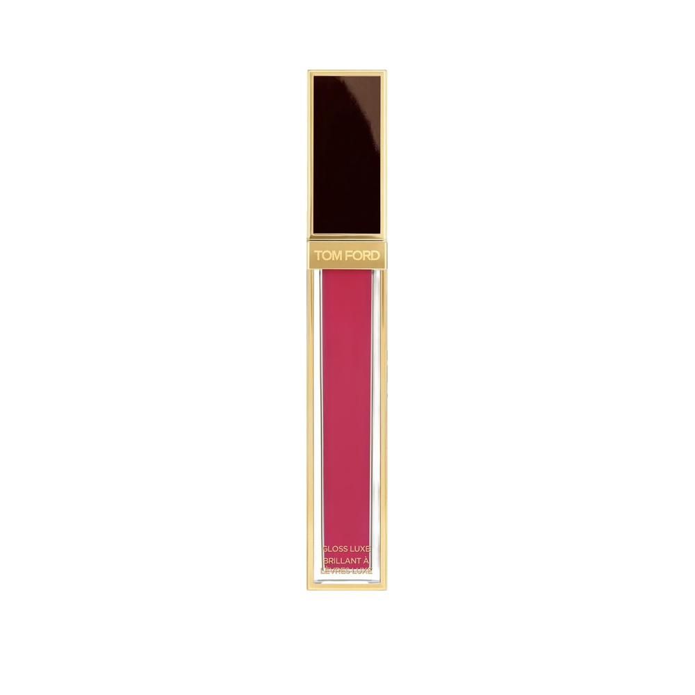 Tube de gloss doré. Contenu rose. Marque Tom Ford.