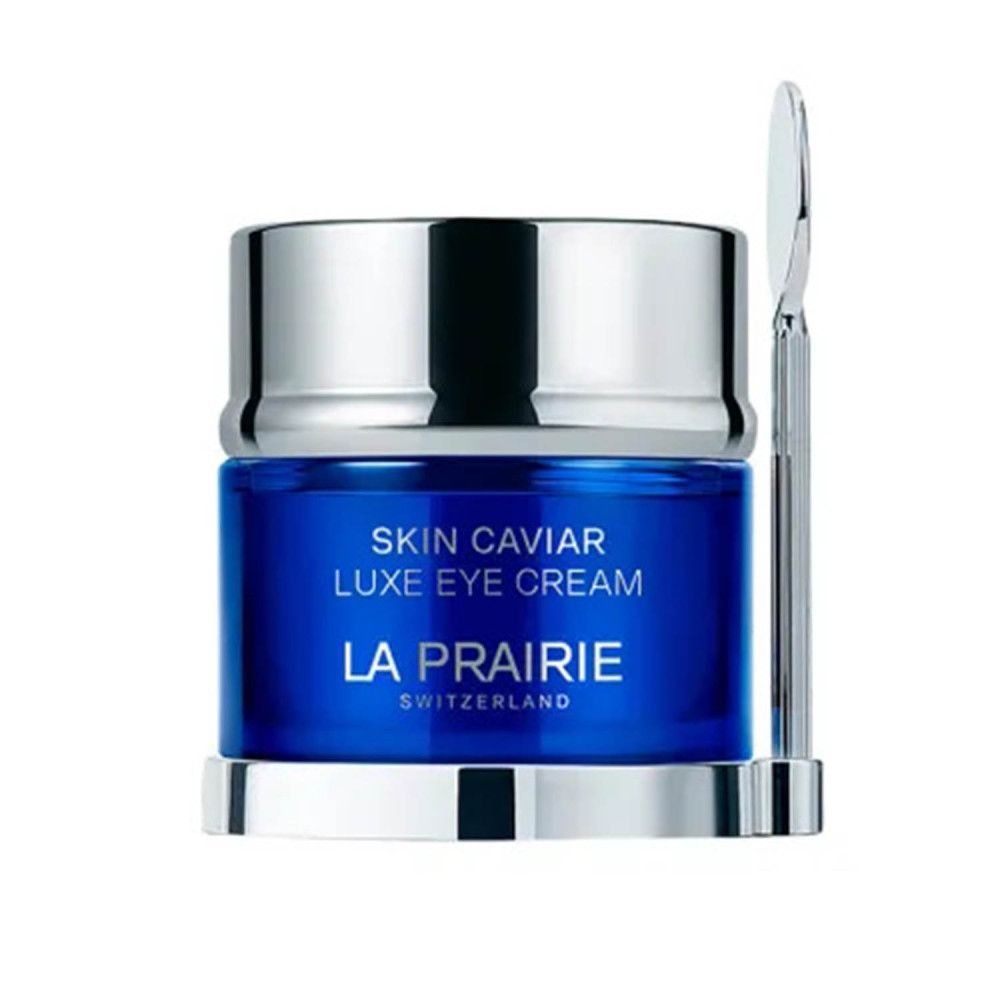 Blauwe pot met zilveren deksel en spatel. Opschrift: Skin Caviar Luxe Eye Cream, La Prairie, Switzerland.