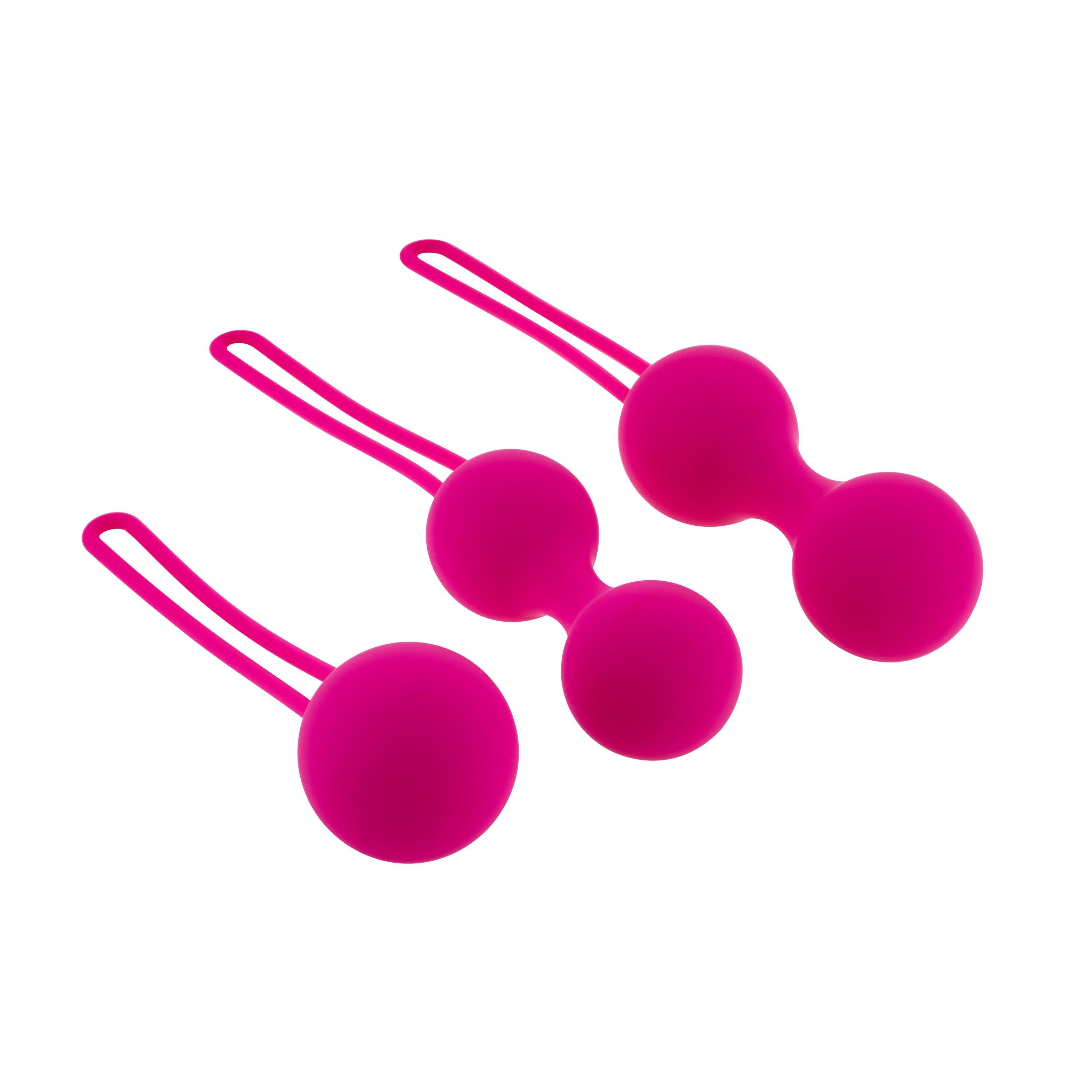 Trois boules roses avec des boucles. Différentes tailles.