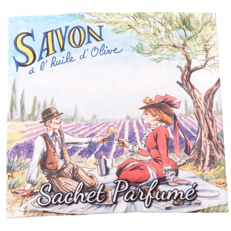 Emballage de sachet parfumé avec illustration de pique-nique dans un champ de lavande. Texte : "Savon à l'huile d'Olive" et "Sachet Parfumé".