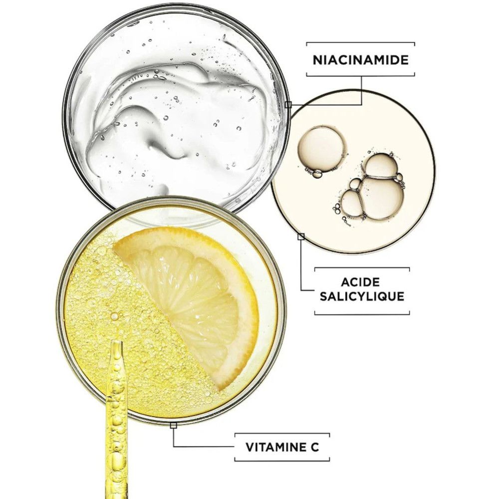 Gros plan sur les ingrédients: Vitamine C, Niacinamide et Acide Salicylique. Montré dans des boîtes de Pétri avec du citron et du sérum.
