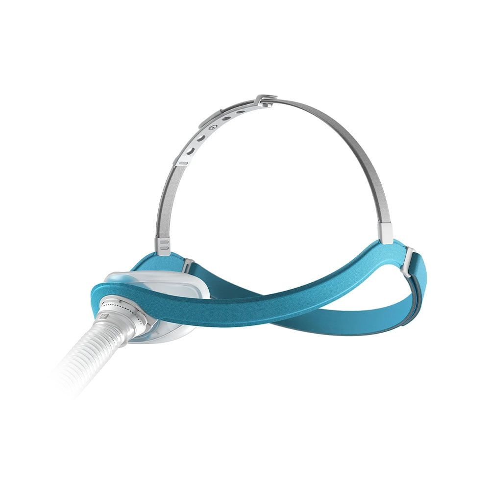 Vue latérale du masque nasal avec bandeau bleu et raccord de tube.