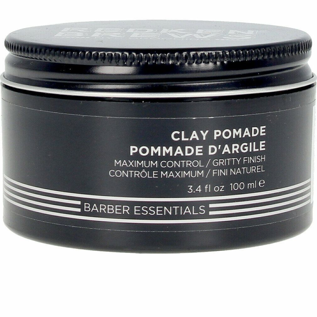 Pot noir avec couvercle. Inscription: Clay Pomade, Pommade d'Argile, Barber Essentials. 3.4 fl oz 100 ml.