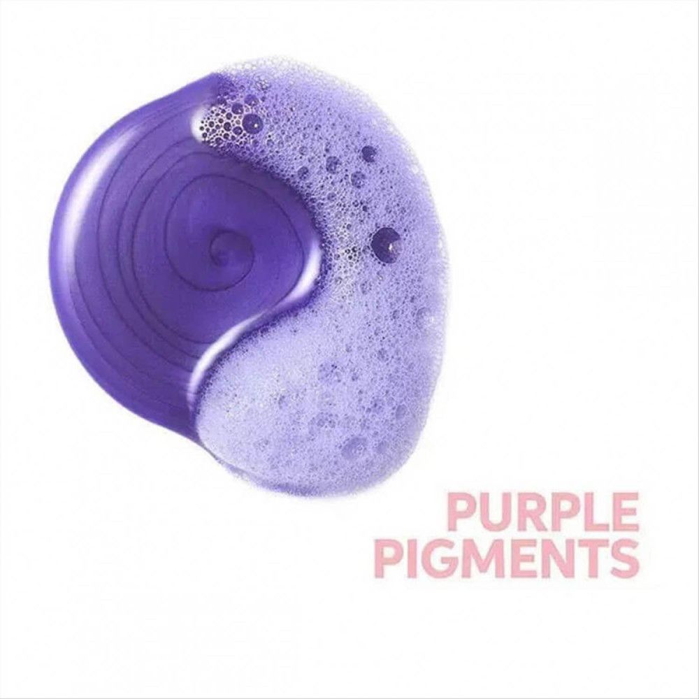 Cirkelvormige paarse shampoo vlek met schuim. Tekst: Purple Pigments.