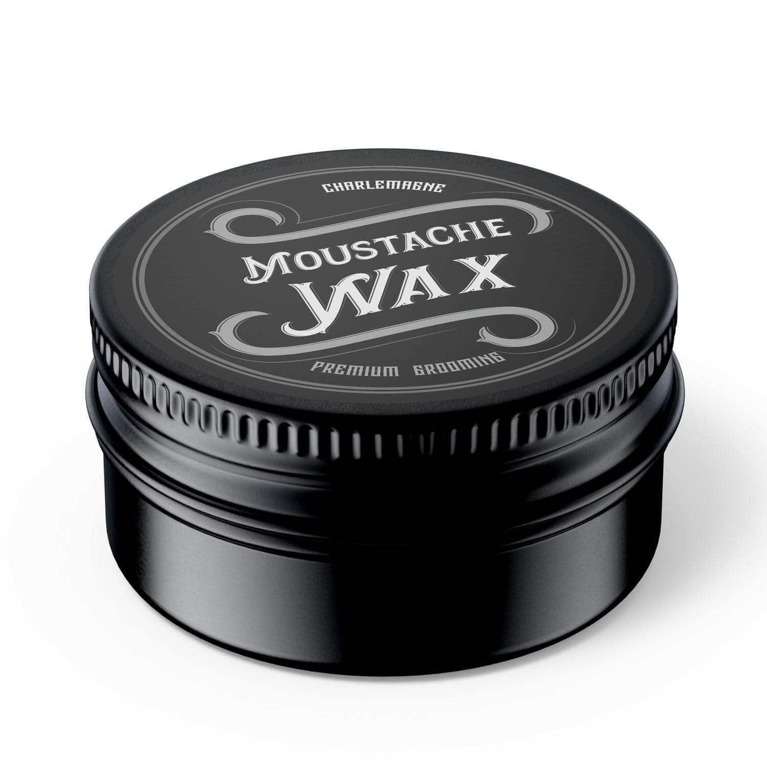 Boîte ronde noire avec inscription argentée « Moustache Wax ». Couvercle à bord cannelé. « Premium Grooming ».
