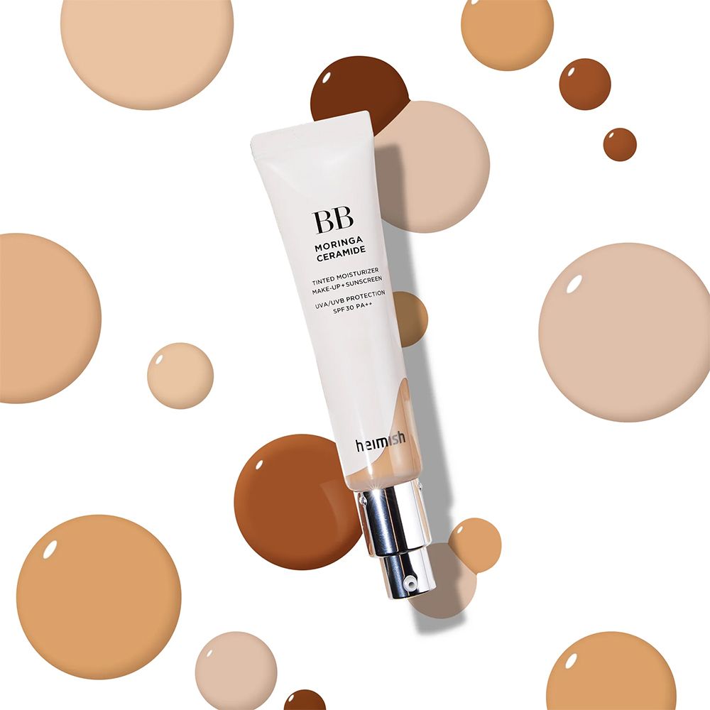 Crème BB Moringa Ceramide entourée de gouttes de couleur dans différentes teintes.