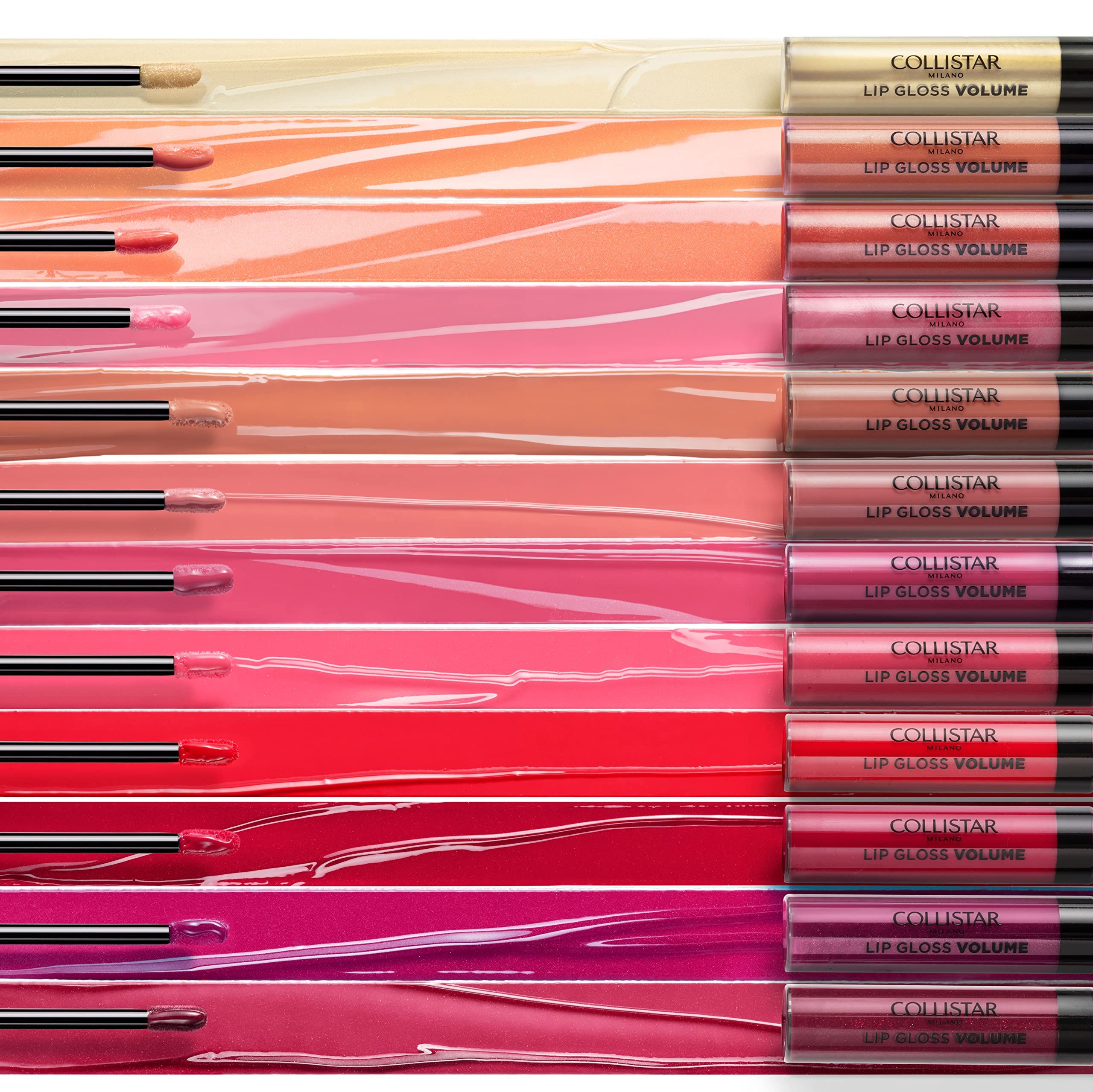 Différentes couleurs de gloss à lèvres appliquées. Bouchons noirs. Inscription : COLLISTAR LIP GLOSS VOLUME.