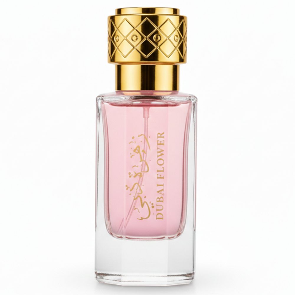 Flacon de parfum rose avec bouchon doré. Inscription arabe et Dubai Flower.
