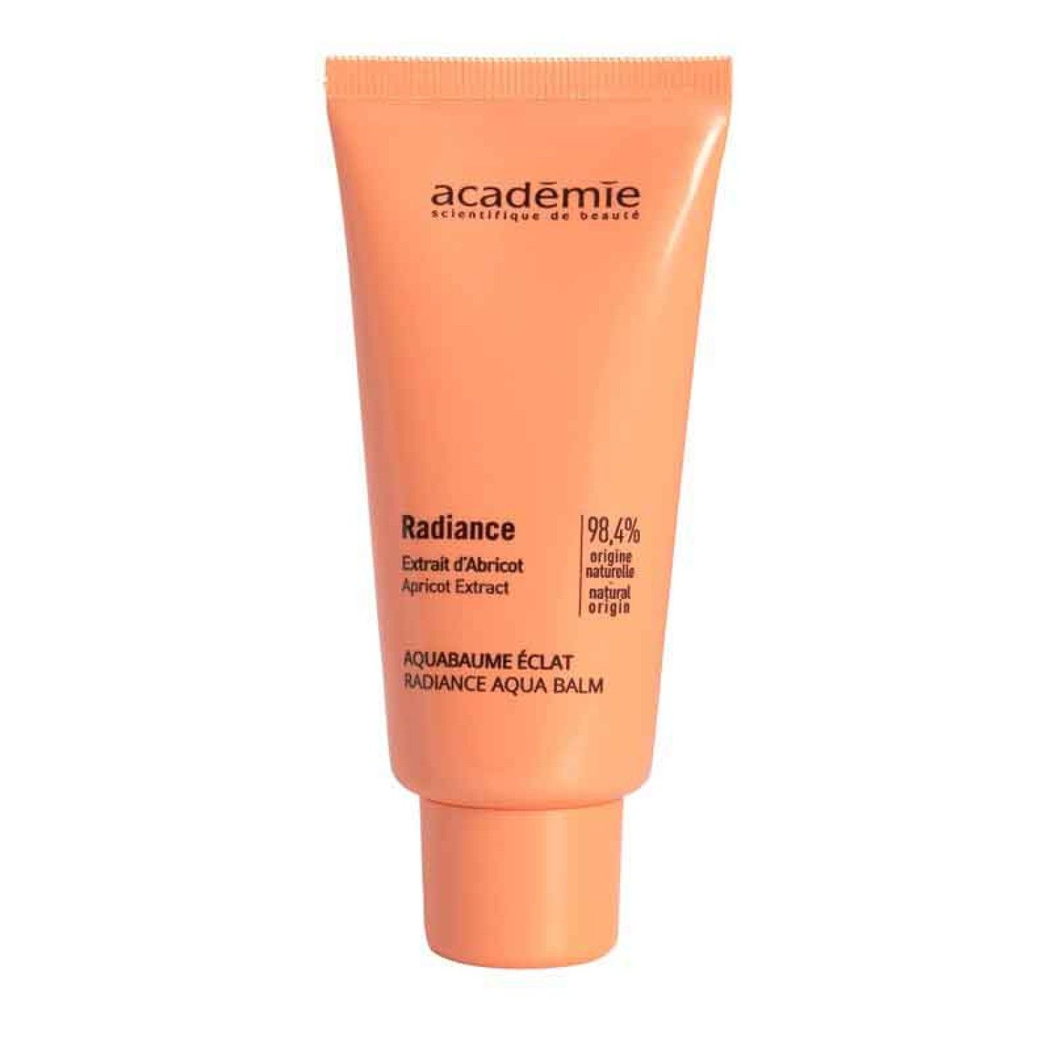 Oranje tube Académie Radiance AQUABAUME ECLAT. Opschrift: Extrait d'abricot, 98,4% natuurlijke oorsprong. Tekst in het Frans en Engels.