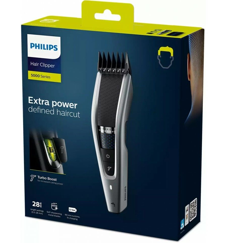 Tondeuse Philips sur emballage. Appareil noir et argent. "Extra Power defined haircut" et "Turbo Boost" sont visibles.