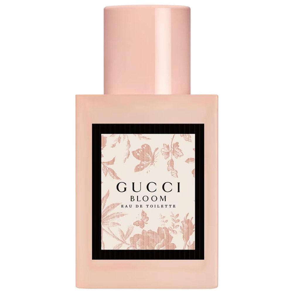 Roze fles met bloemenprint. Opschrift: Gucci Bloom Eau de Toilette.