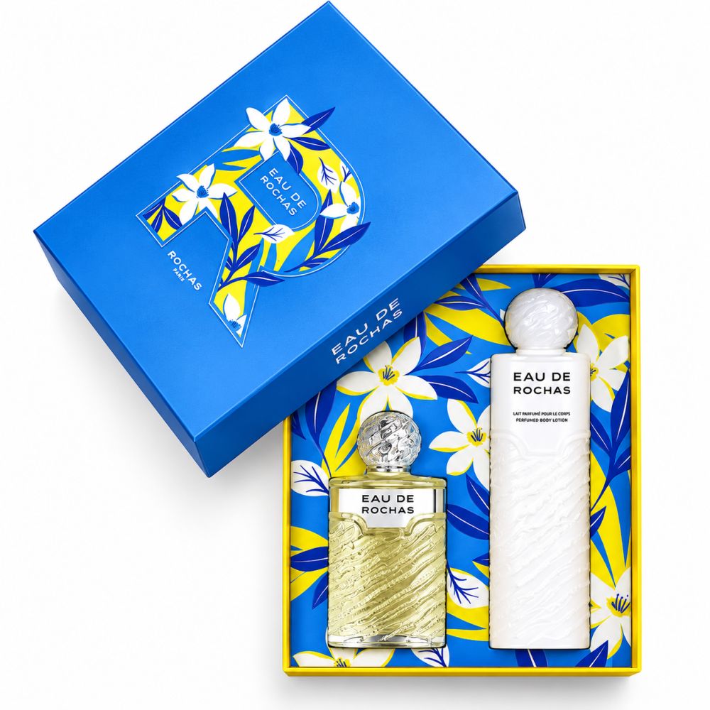 Coffret Rochas Paris contenant une eau de toilette et un lait corporel. Comprend un flacon de parfum et un flacon de lotion blanc.
