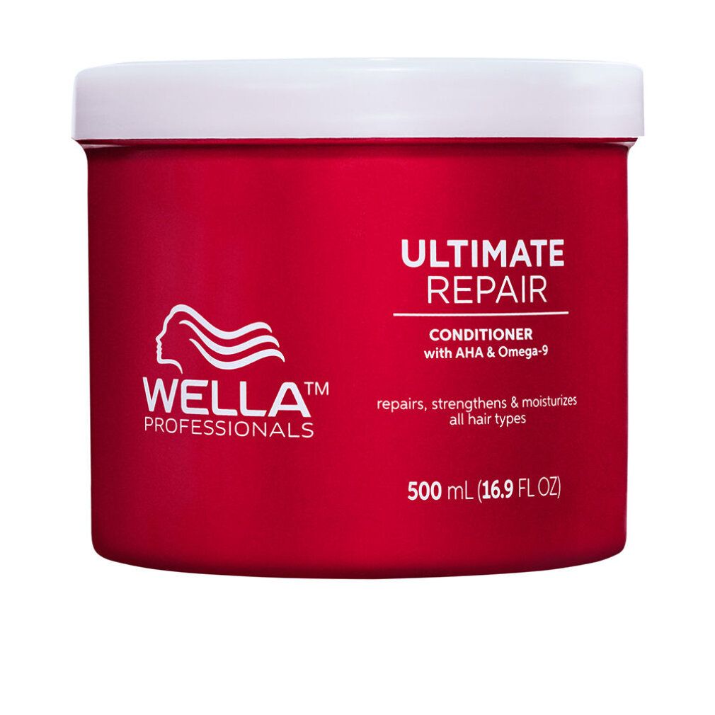 Rode pot met witte deksel. Opschrift: ULTIMATE REPAIR, Conditioner, Wella Professionals logo. Bevat 500 ml.