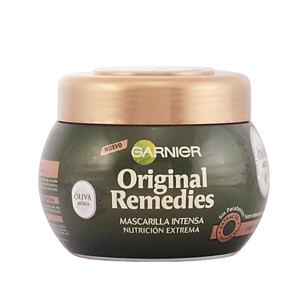 Pot vert foncé avec couvercle doré. Inscription: Garnier Original Remedies. Étiquettes avec informations sur le produit.