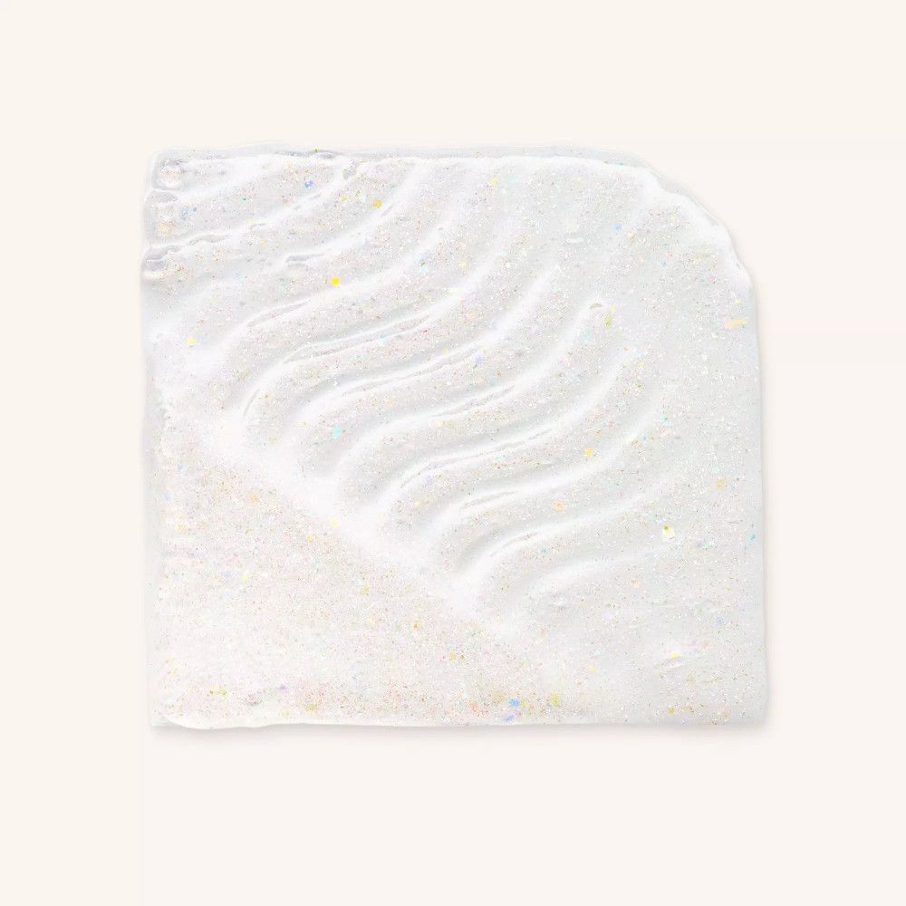 Vierkante klodder getinte lipolie. Golfvormige textuur, glinsterend.