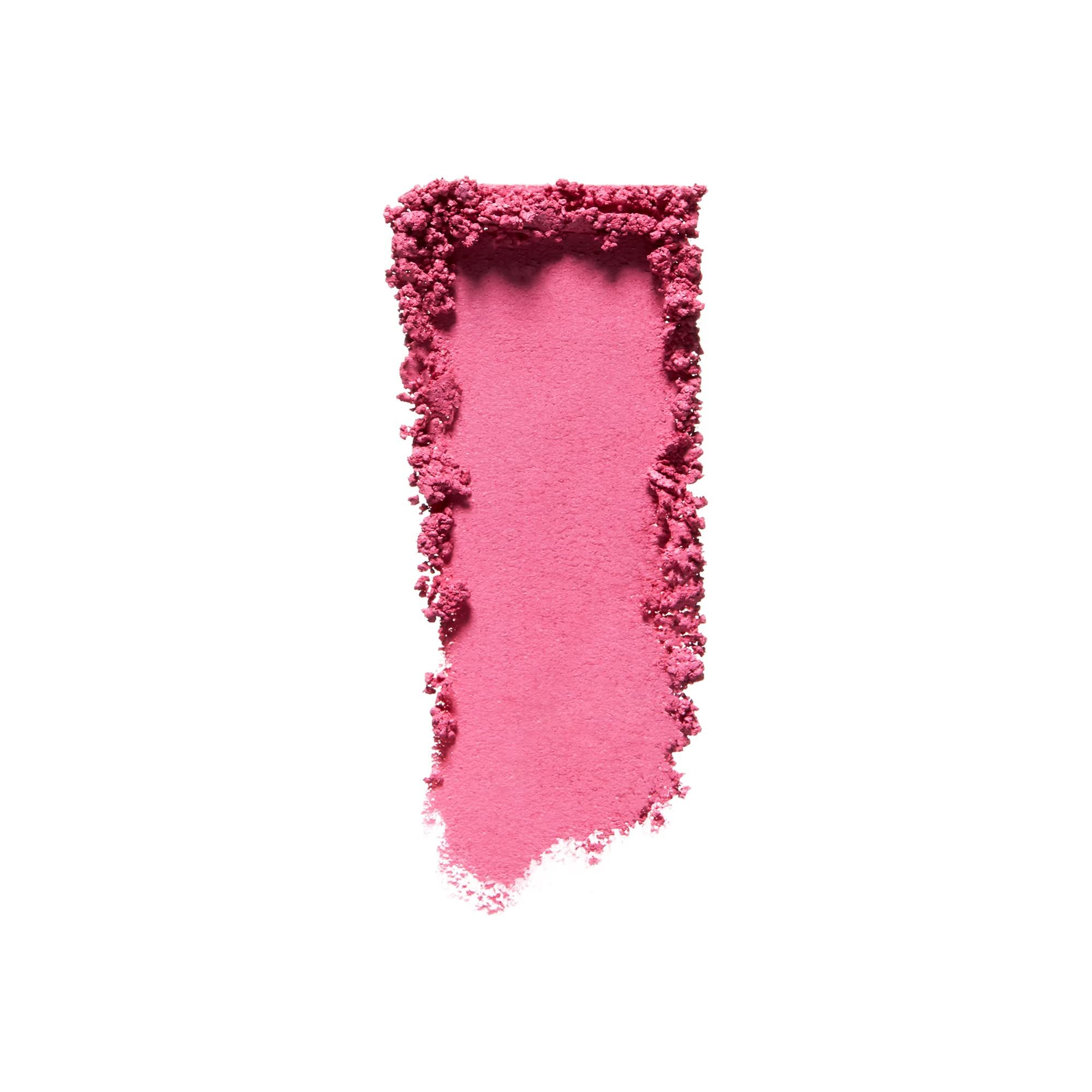 Échantillon de fard à paupières rose sur fond blanc. Texture poudrée, forme irrégulière.