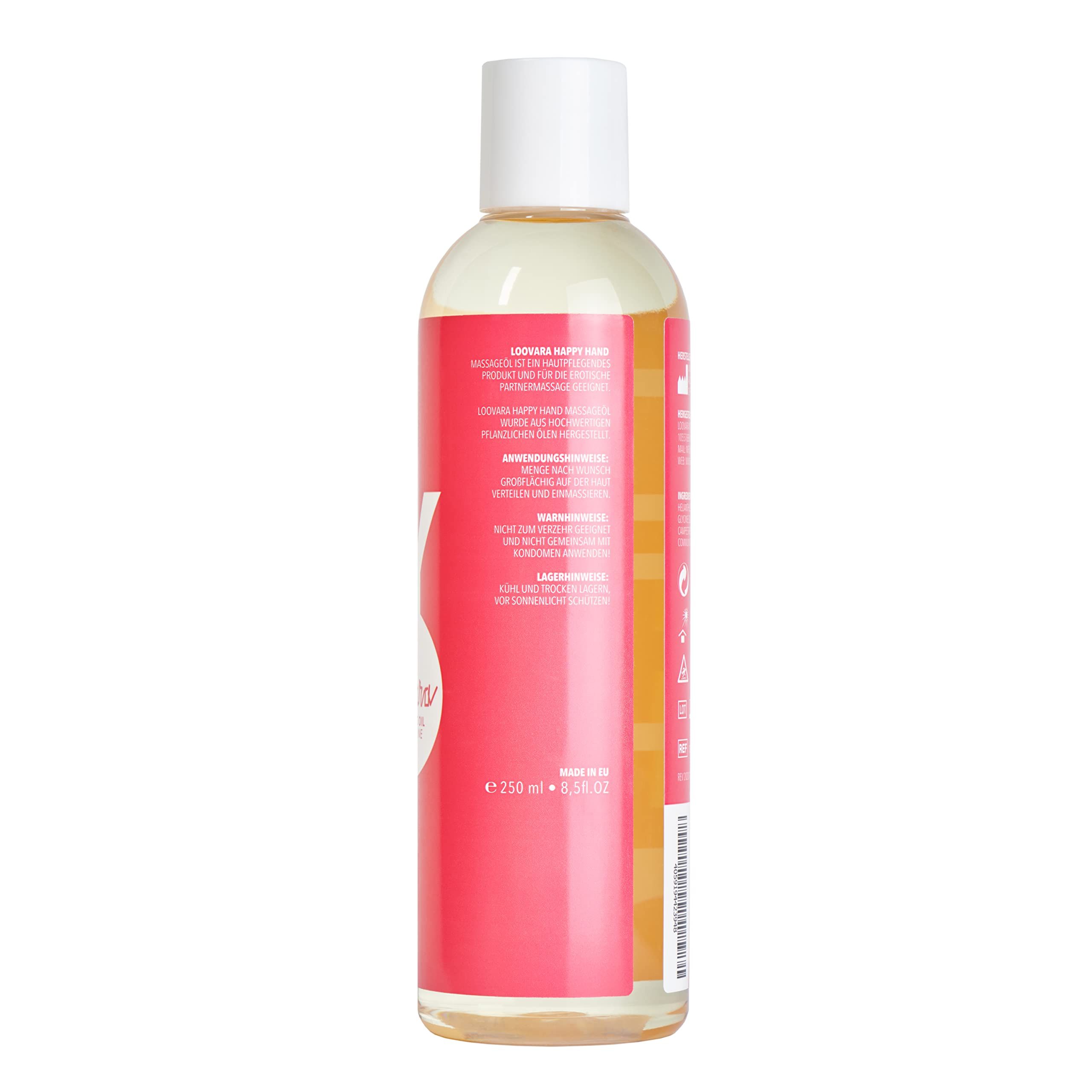 Fles Loovara Happy Hand massageolie met rood label en witte letters, omringd door oliespatten.