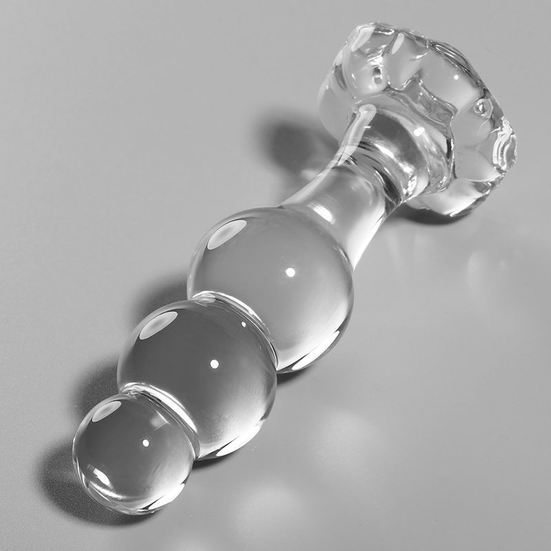 Transparante glazen anale plug met drie kralen en een getextureerd handvat.