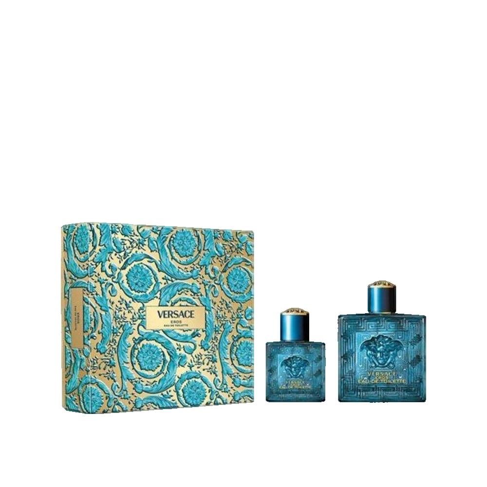 Coffret cadeau avec emballage et deux flacons. Emballage avec ornements bleu et or. Flacons: carrés, bleus, motif en relief.