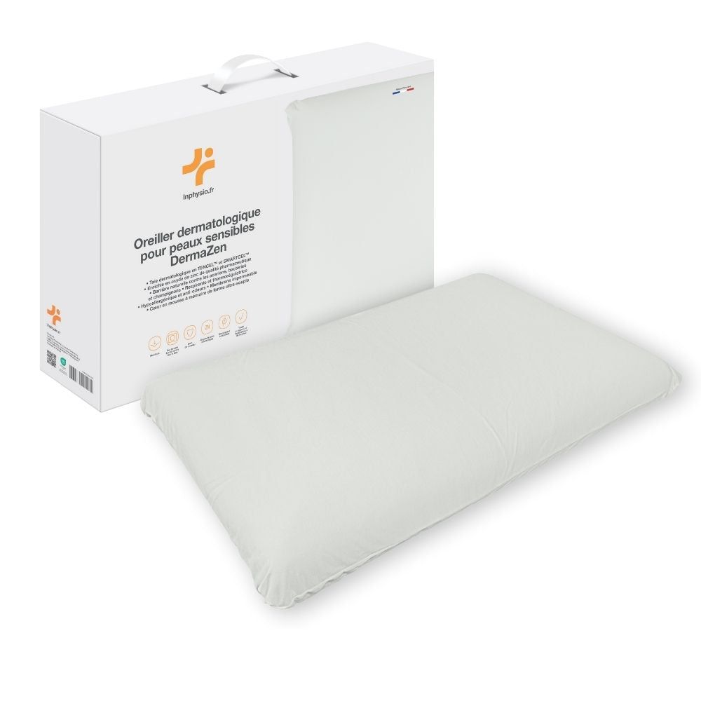 Oreiller blanc et son emballage. Inscription: Oreiller dermatologique pour peaux sensibles DermaZen.