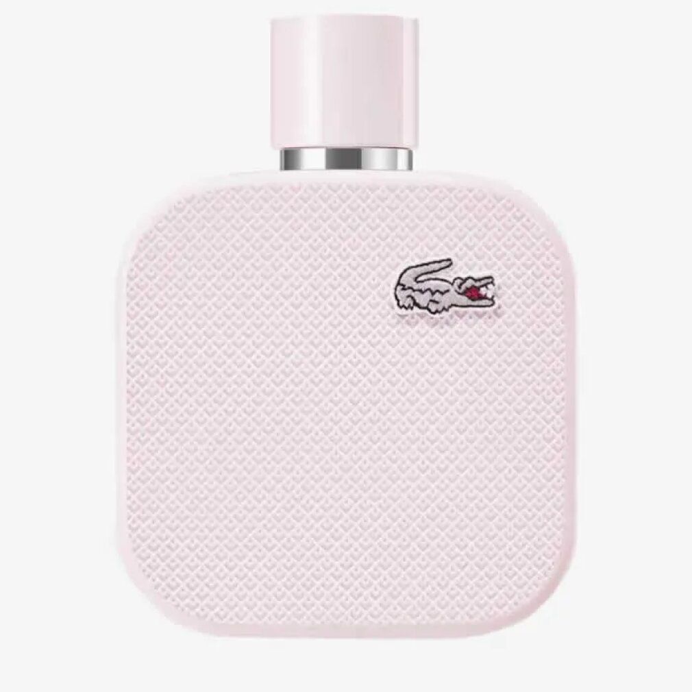 Flacon rose Lacoste L.12.12 Rose Eau de Parfum. Logo crocodile. Forme carrée, surface texturée.