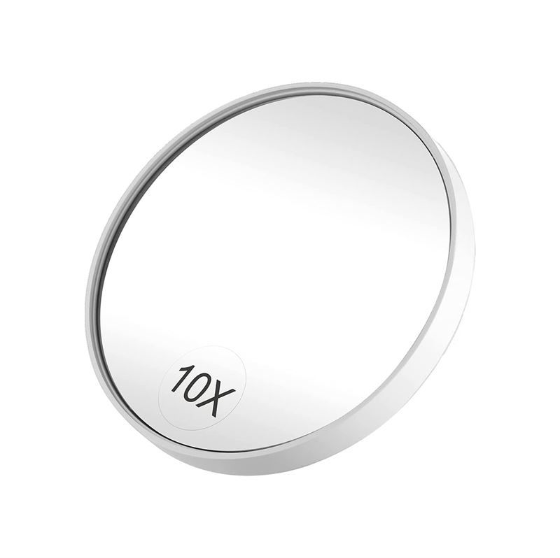 Miroir grossissant rond avec un grossissement 10x et un cadre blanc.