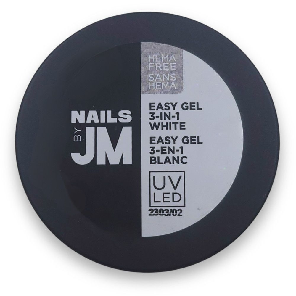 Pot rond noir avec étiquette blanche. Inscription: EASY GEL 3-IN-1 WHITE, SANS HEMA. Marque: NAILS BY JM. UV LED.