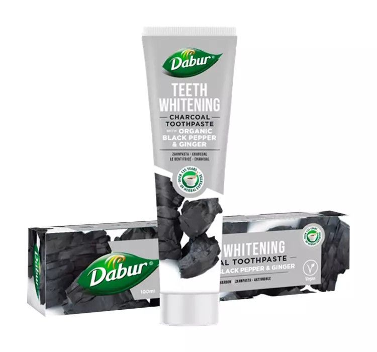 Tube et boîte de dentifrice Dabur Herbal, blanchissant, au charbon actif, poivre noir et gingembre.
