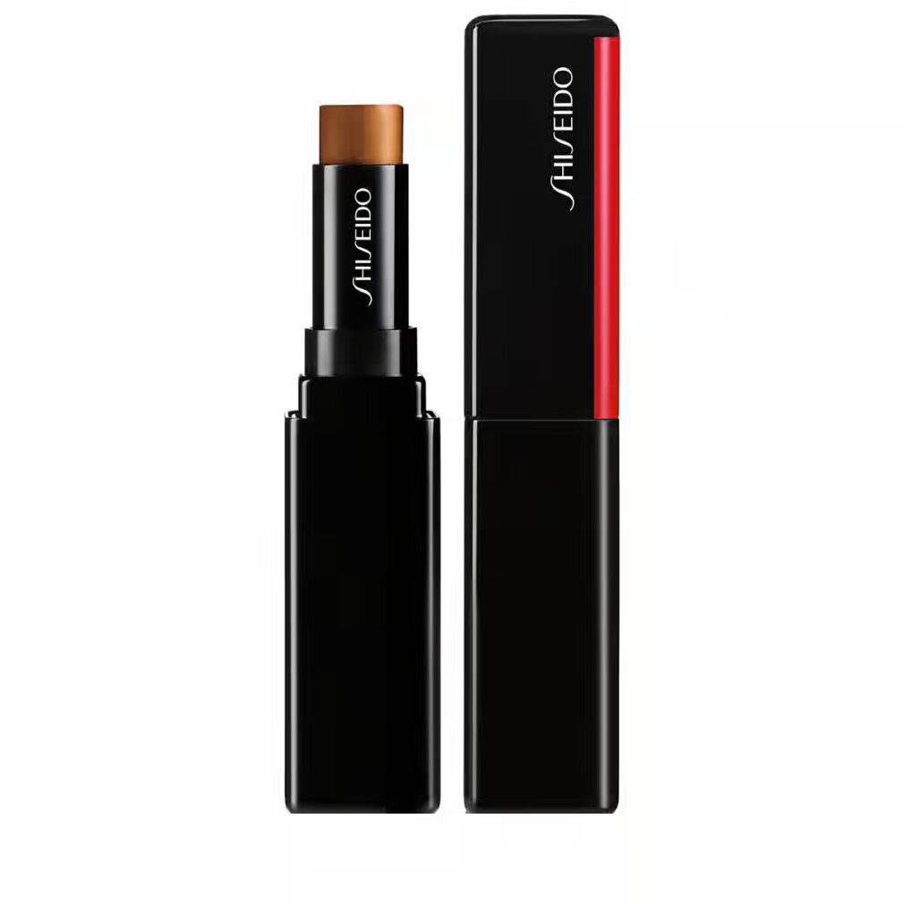Correcteur Shiseido Synchro Skin Gelstick. Bâton noir avec correcteur brun. Accent rouge. Marque Shiseido.