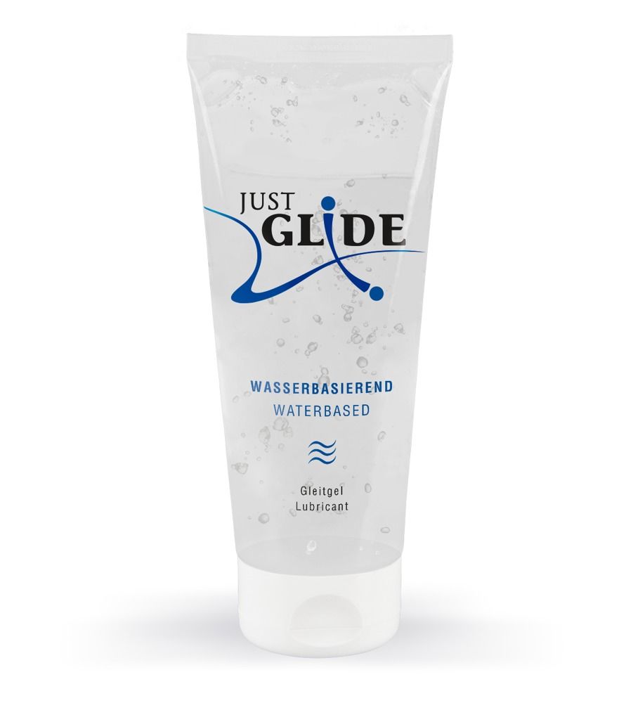 Tube de gel lubrifiant transparent. Inscription: Just Glide, à base d'eau. Gel visible.