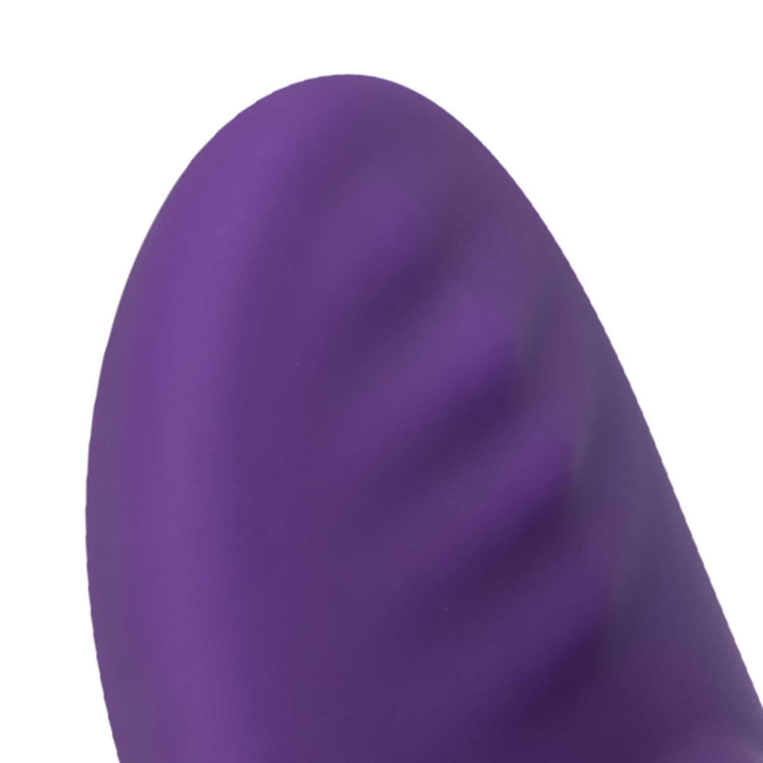 Gros plan de l'extrémité arrondie d'un vibrateur violet.