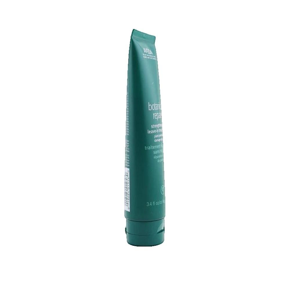 Tube vert, vue latérale. "AVEDA" en haut. Texte: "botanical repair.". En bas: "3.4 fl oz/100 ml".