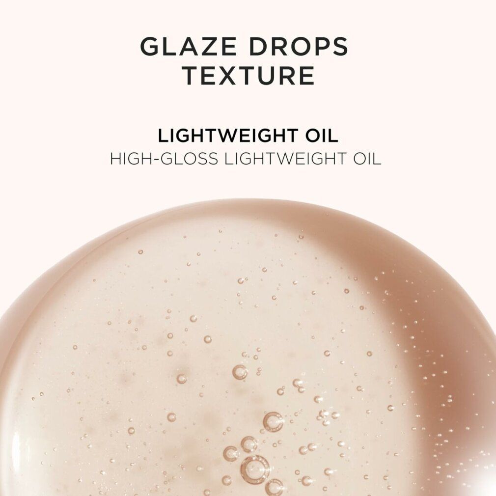 Close-up van olie. Tekst: Glaze Drops Texture, Lightweight Oil, High-Gloss Lightweight Oil. Bellen in de olie.