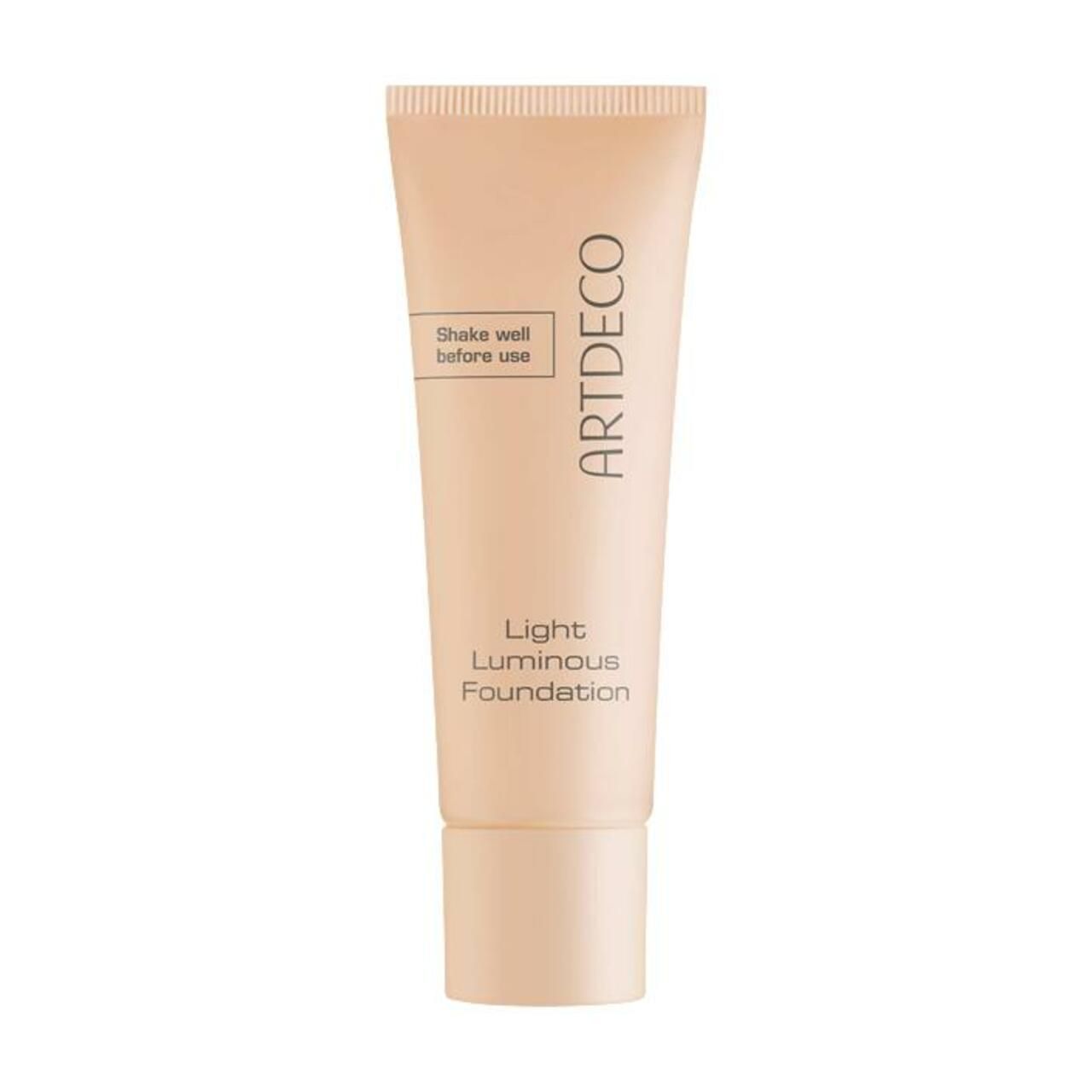 Beige tube met product. Opschrift: ARTDECO, Light Luminous Foundation. Tekst: Shake well before use.