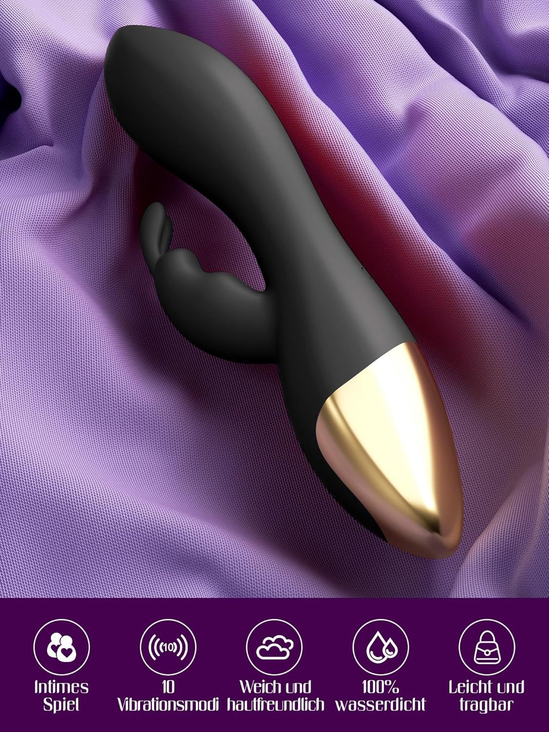 Vibrateur G-spot noir avec extrémité dorée, posé sur un tissu violet.