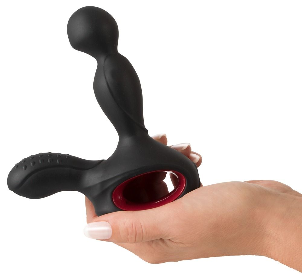 Hand die een zwarte siliconen prostaatstimulator met rode ring vasthoudt.