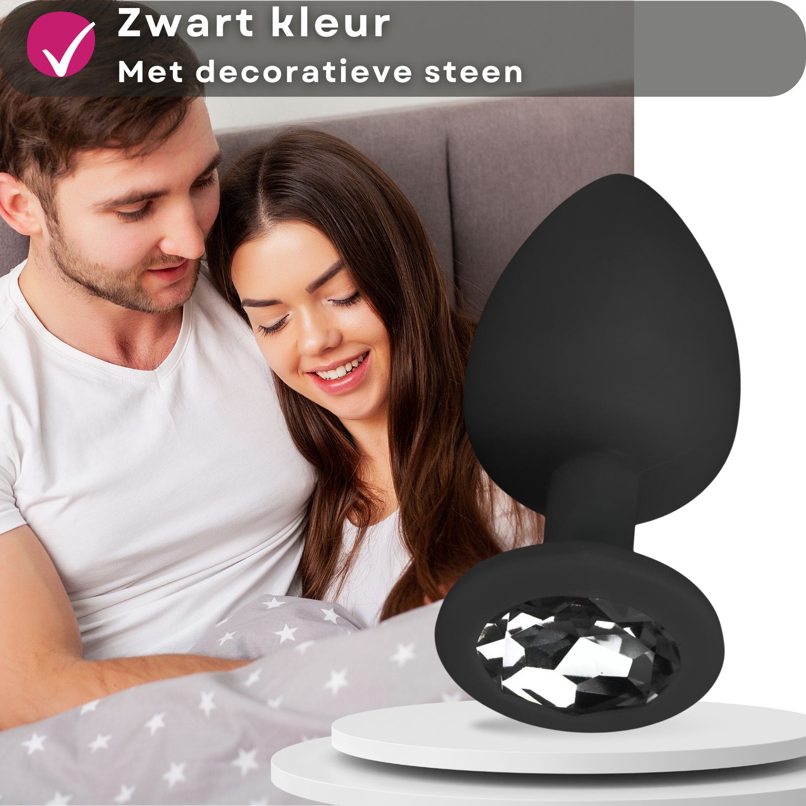 Zwarte anale plug met decoratieve steen. Paar op de achtergrond.