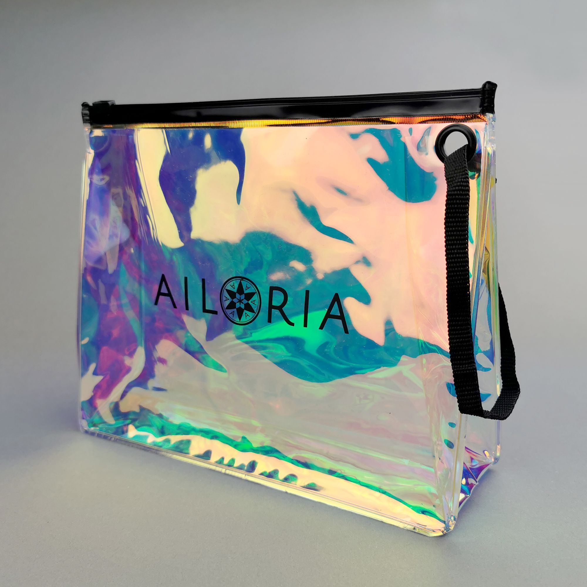 Sac transparent avec logo AILORIA et poignée. Effet holographique.
