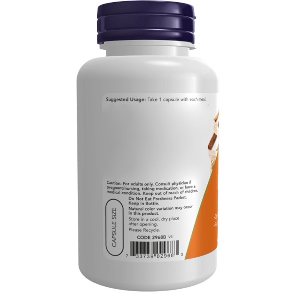 Witte capsule-formaat fles met donkerblauwe dop en etiket met gebruiksinstructies en waarschuwingen.